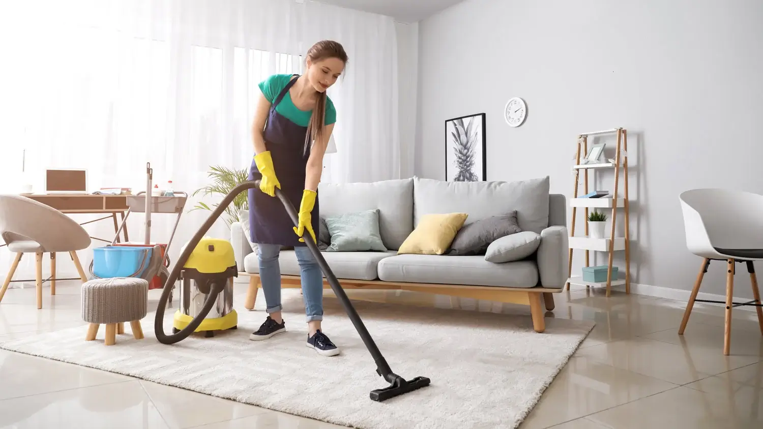female-janitor-vacuums-living-room-2 female-janitor-vacuums-living-room-2-1